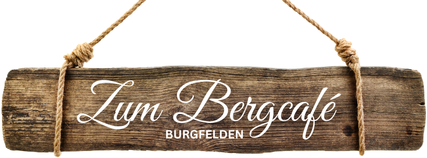 holzbalken mit aufschrift zum bergcafe